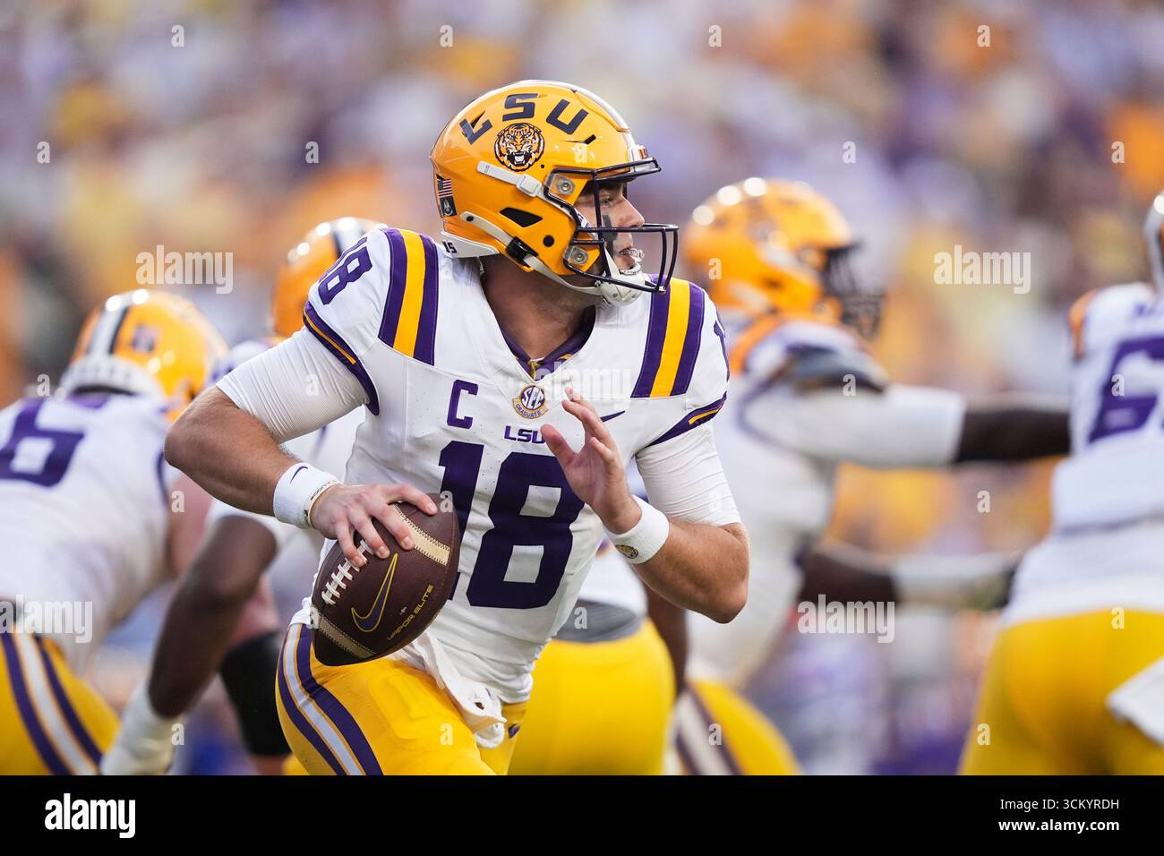 LSU quarterback Garrett Nussmeier (18) scrambles in the first half of