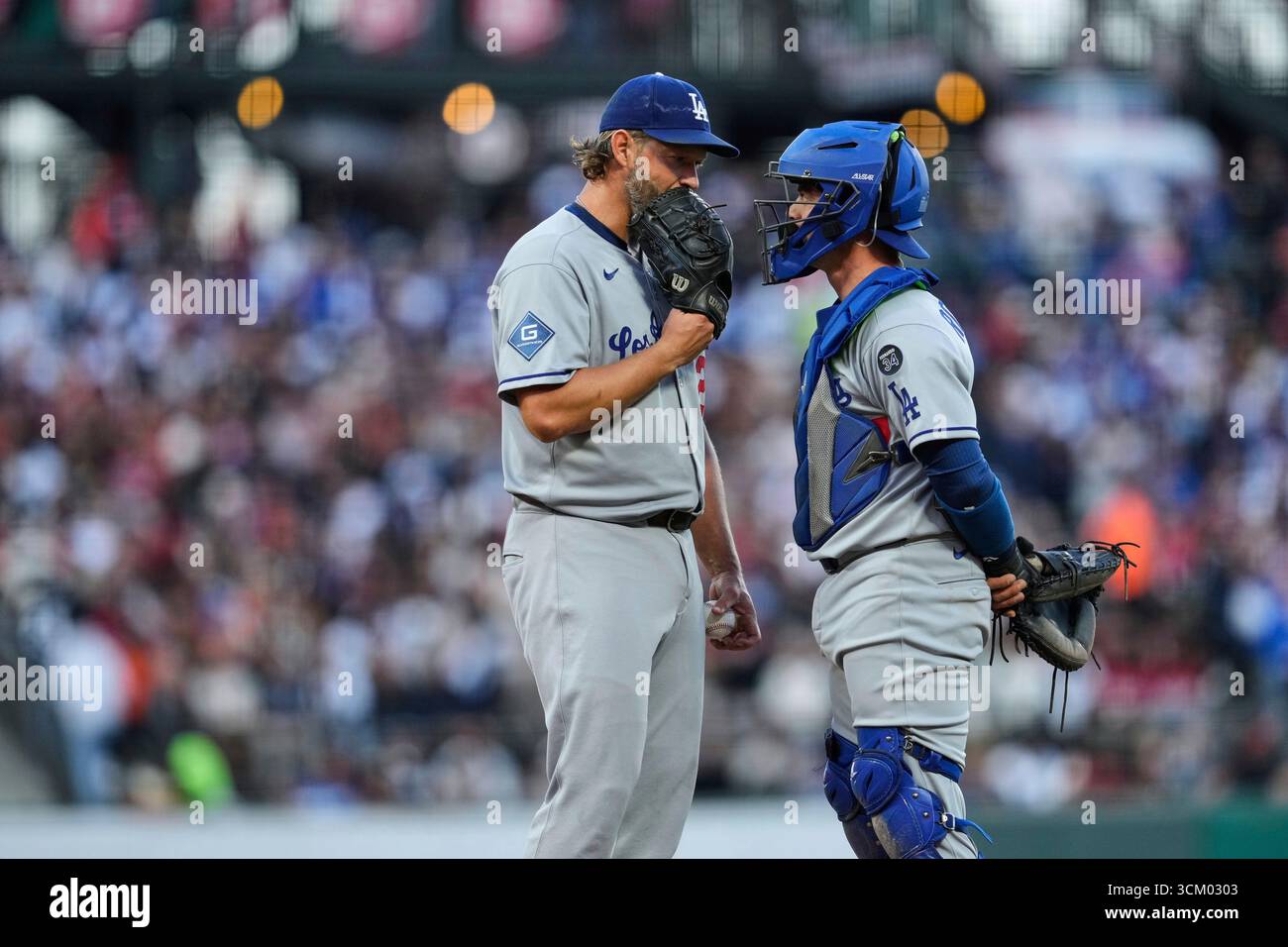 Los Angeles Dodgers pitcher Clayton Kershaw, left, talks with catcher ...