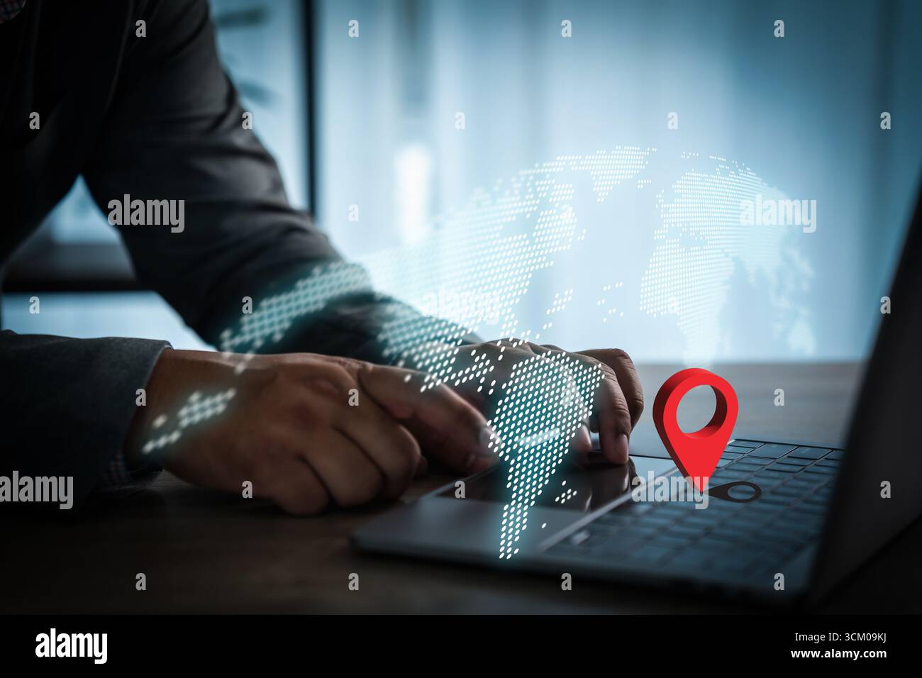 Businessman using laptop with digital world map and red location pin symbol, representing global network, GPS navigation, worldwide connection, and mo Stock Photo