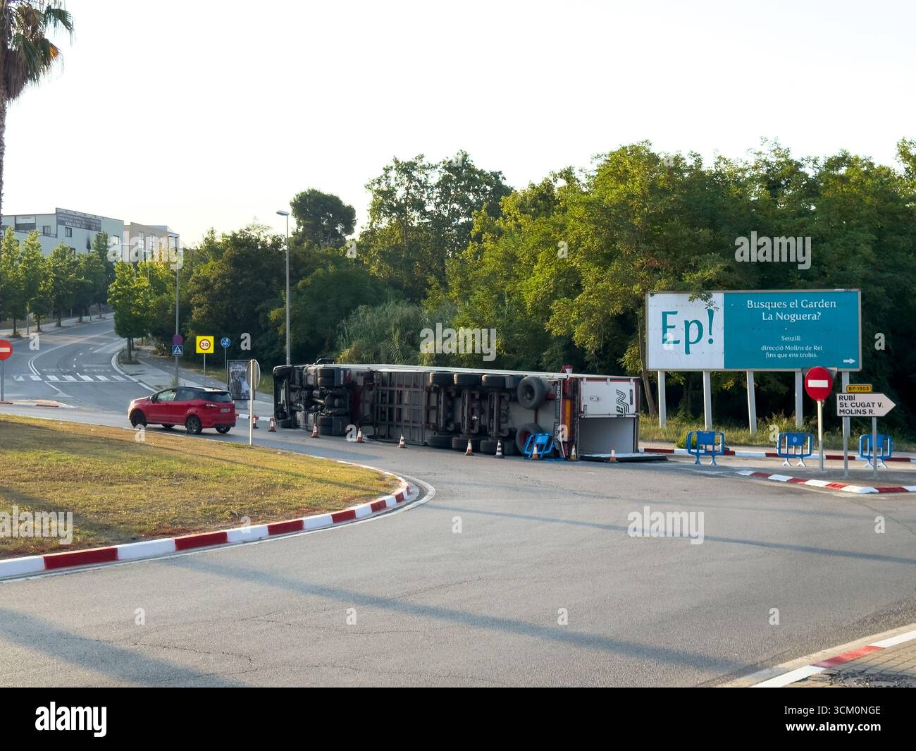 Rubi, Barcelona, Spain. August 9, 2025. An overturned truck causes a traffic jam on a suburban road. The accident illustrates transportation problems - Smartphone Captured Stock Image