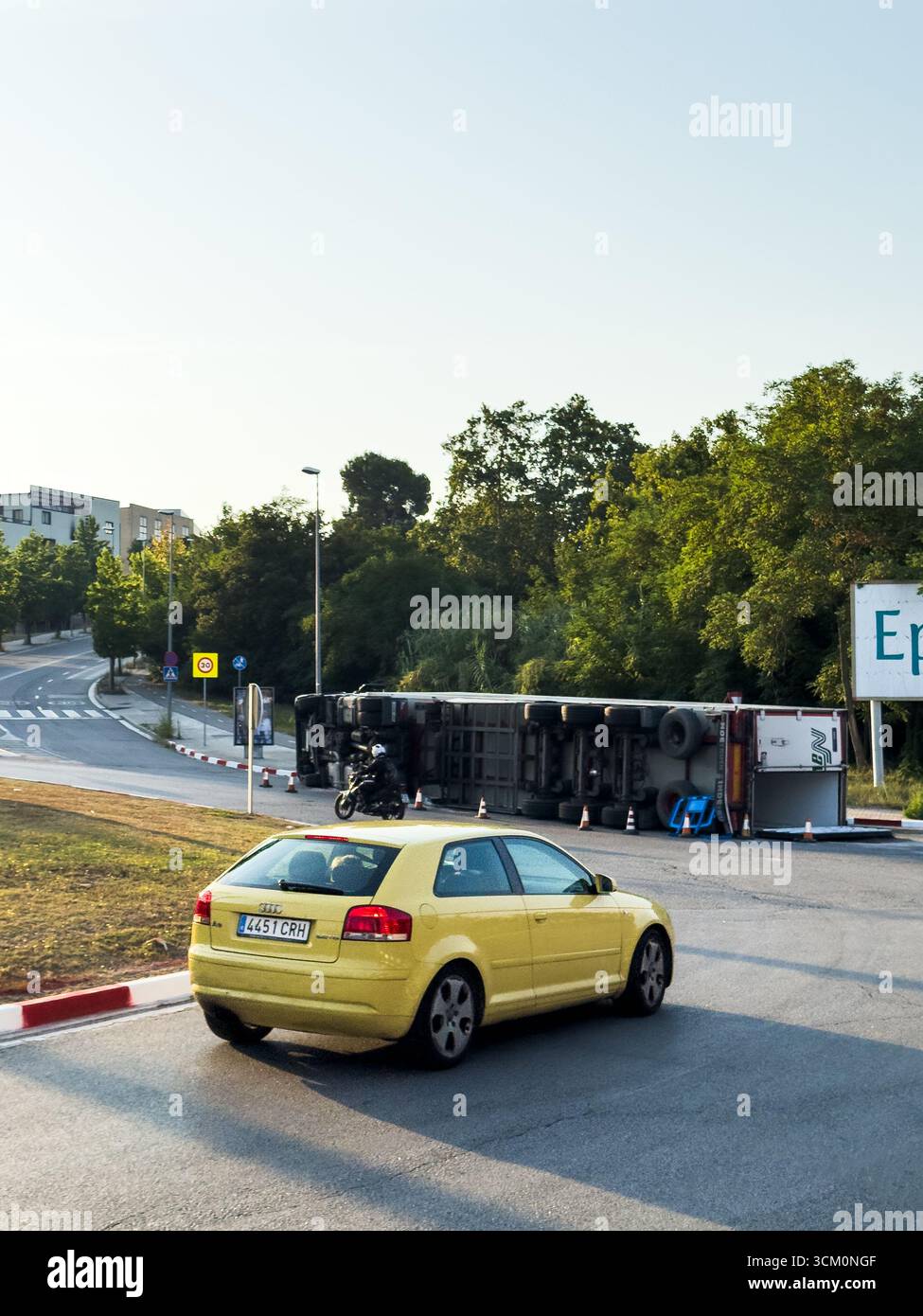 Rubi, Barcelona, Spain. August 9, 2025. An overturned truck causes a traffic jam on a suburban road. The accident illustrates transportation problems - Smartphone Captured Stock Image