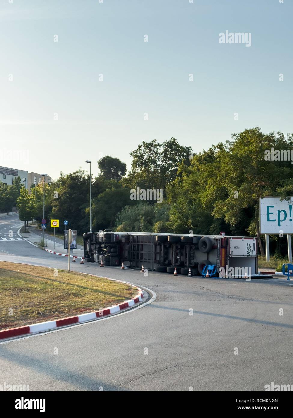 Rubi, Barcelona, Spain. August 9, 2025. An overturned truck causes a traffic jam on a suburban road. The accident illustrates transportation problems - Smartphone Captured Stock Image