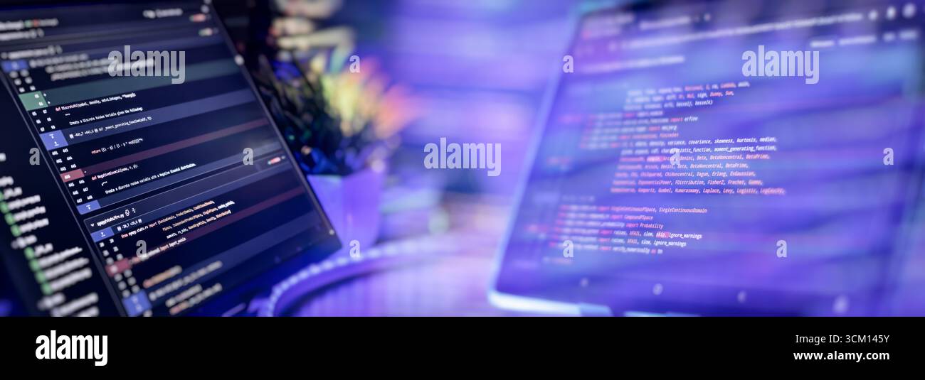 Modern coding setup with two monitors displaying Python scripts, showcasing software development, scripting, and a high-tech workflow. Stock Photo