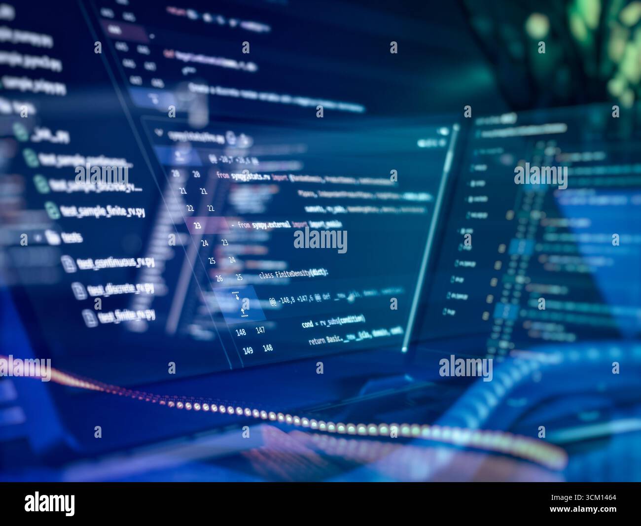 Modern software development with multi-screen coding setup Stock Photo