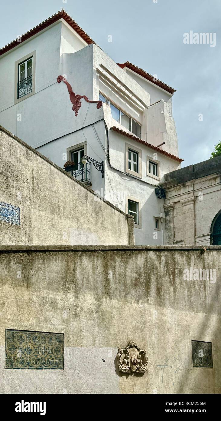 Residential dwelling with high walls and areas of Azulejos traditional tiles - Smartphone Captured Stock Image