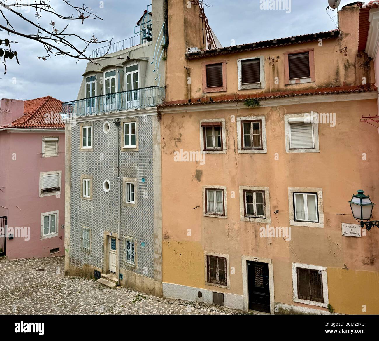 Rustic traditional residential buildings one with facade of Azulejo tiles in Alfama Lisbon Portugal - Smartphone Captured Stock Image