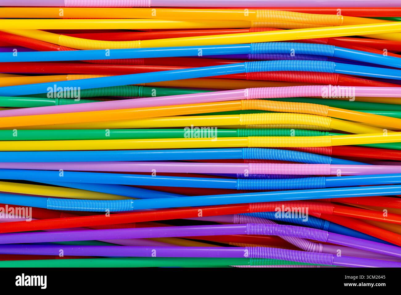 Horizontal Stack of Colorful Bendable Drinking Straws Stock Photo