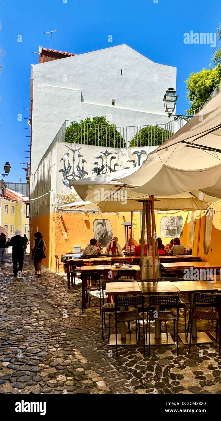 Alfresco dining in Alfama Lisbon Portugal - Smartphone Captured Stock Image
