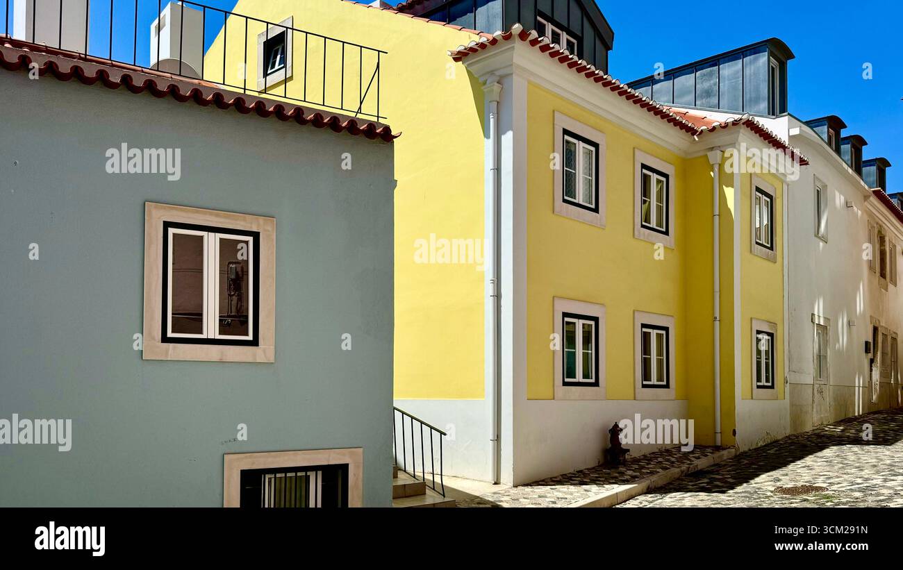 Patel coloured residential buildings in Alfama Lisbon Portugal - Smartphone Captured Stock Image