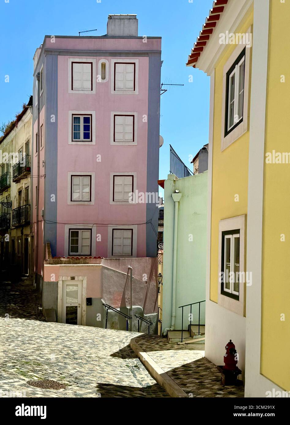 Patel coloured residential buildings in Alfama Lisbon Portugal - Smartphone Captured Stock Image
