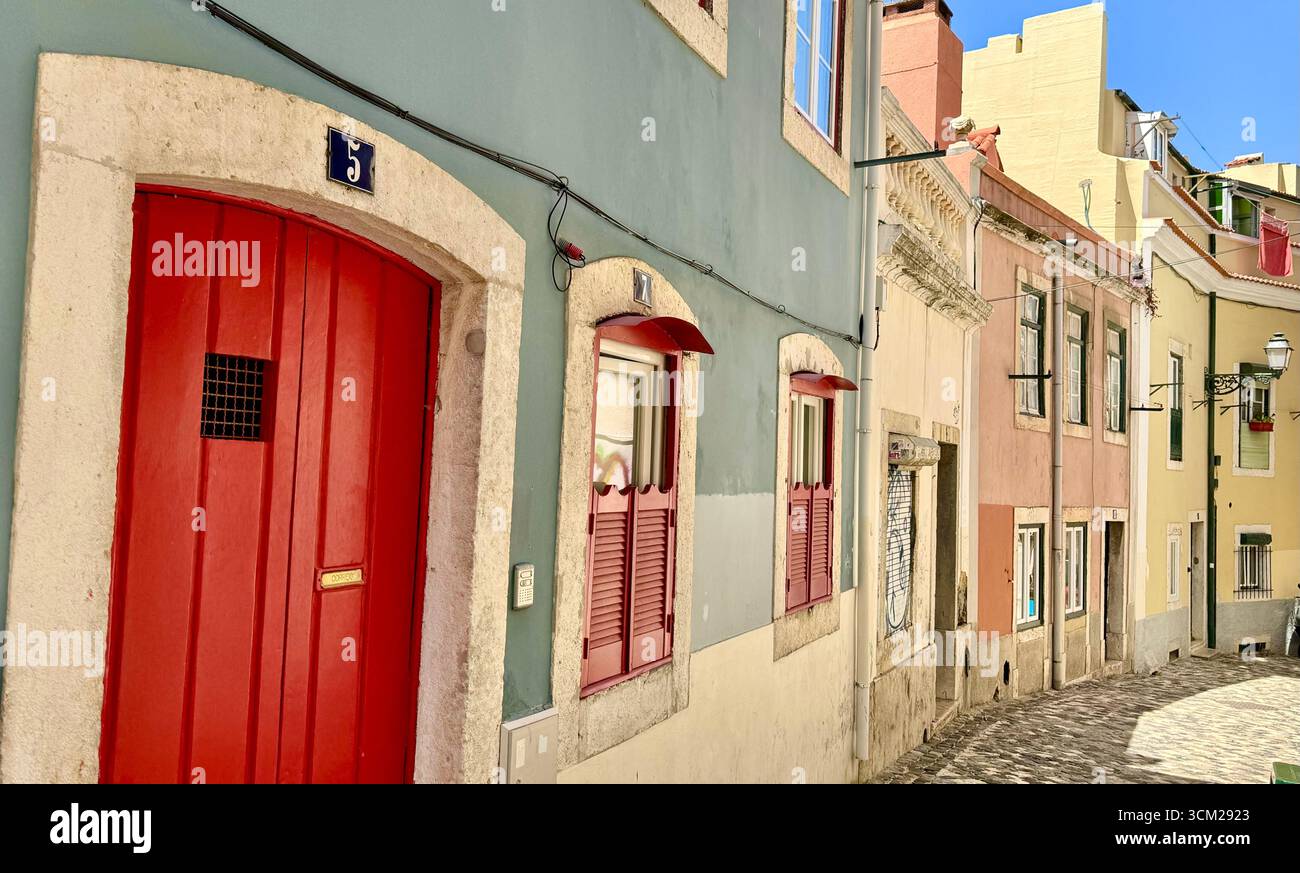 Patel coloured residential buildings in Alfama Lisbon Portugal - Smartphone Captured Stock Image