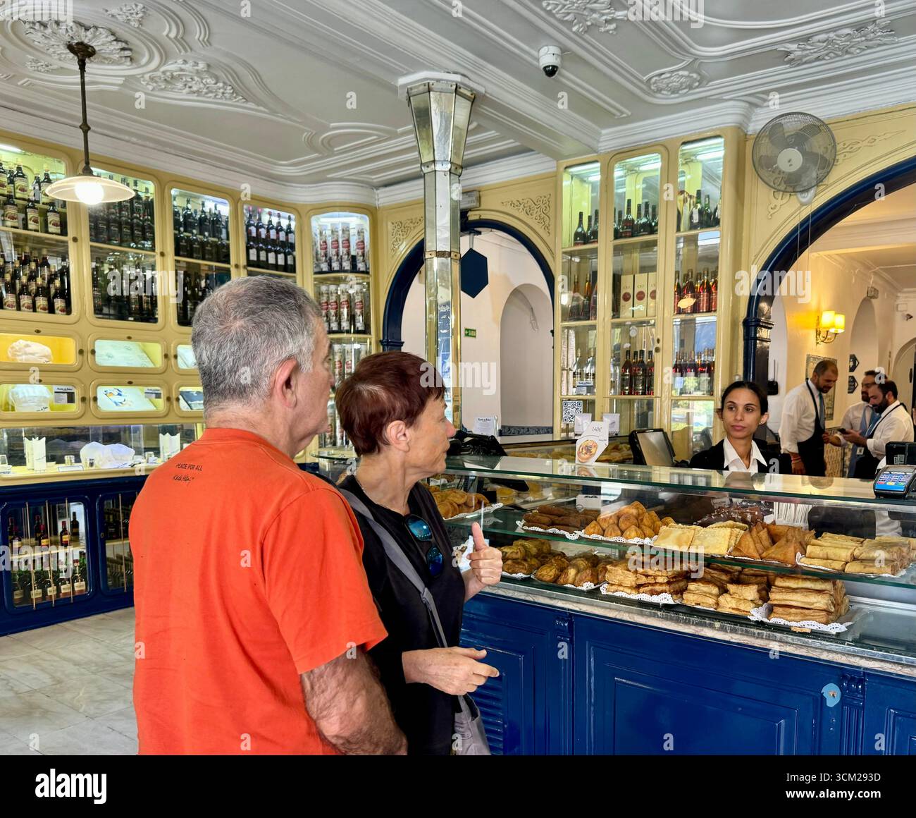 Customers in Fábrica de Pastéis de Belém cafe where the original Pastel de nata are baked in Belém Lisbon Portugal - Smartphone Captured Stock Image