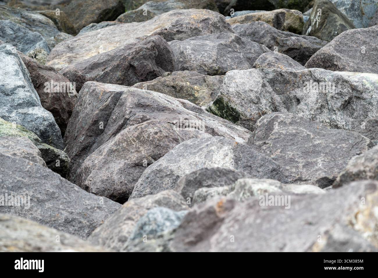 Random sized rocks as part of a sea defence, showing shapes and ...