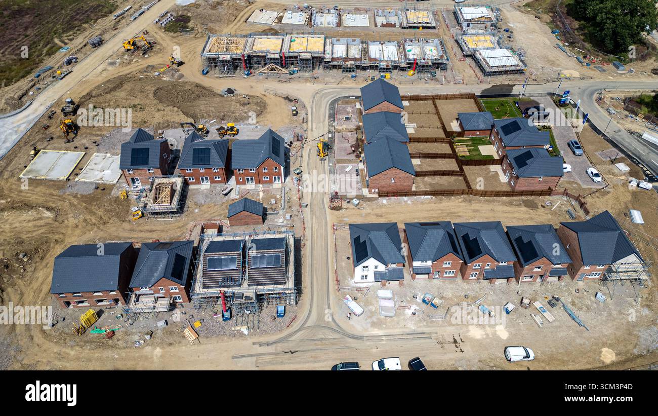 Aerial view of a residential construction site with houses in various ...