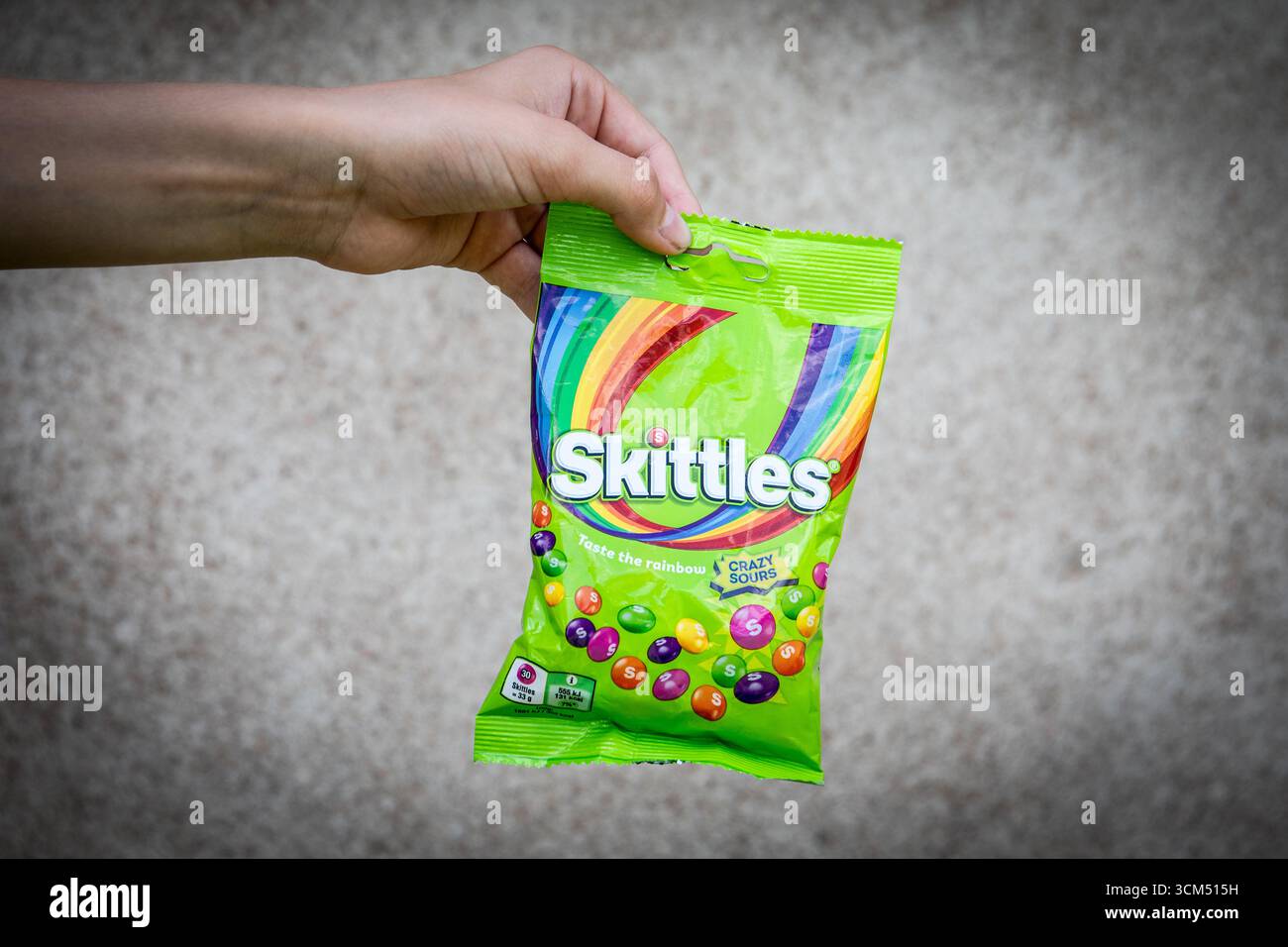Skittles Crazy Sours candy held in hand. Sigulda Latvia on August 15 2025 Stock Photo