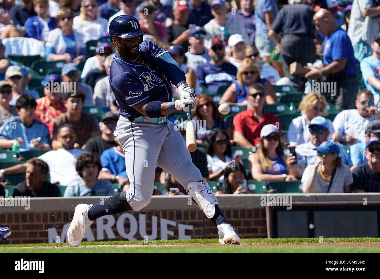 Tampa Bay Rays' Yandy Díaz hits a home run against the Chicago Cubs