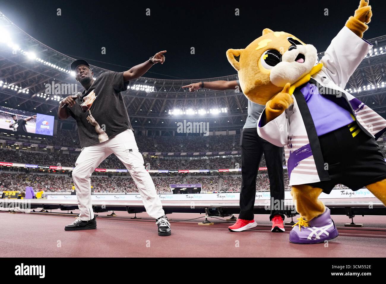 Retired Jamaican sprinter Usain Bolt shows his iconic pose to the crowd ...