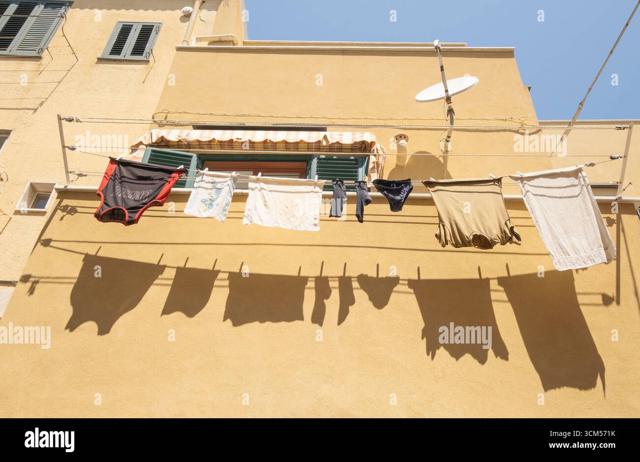 Detail of facade with clothesline in Coricella, Procida Island, Gulf of Naples, Italy, Europe Stock Photo
