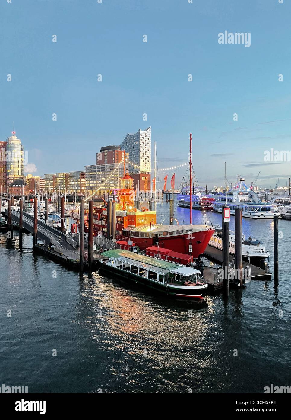 The Port of Hamburg at dusk, lightship and Elbphilharmonie, Hamburg, Germany, Europe Stock Photo
