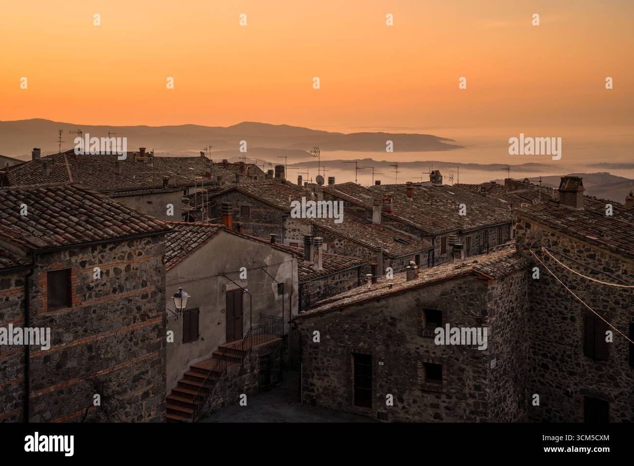 Early morning over the roofs of Radicofani, province of Siena, Tuscany, Italy Stock Photo