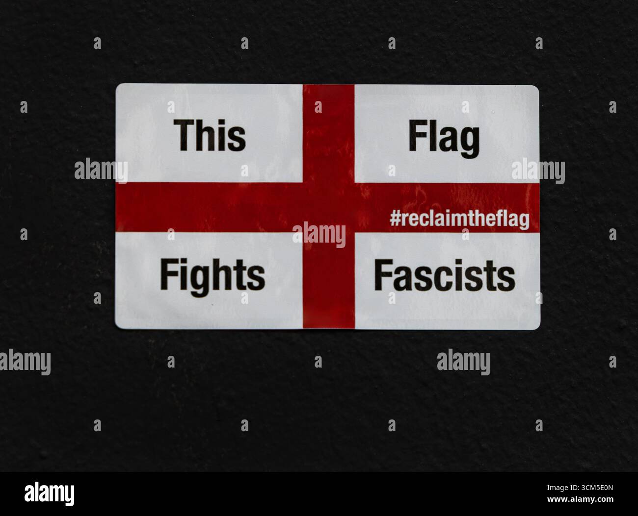 An anti-fascist sticker with a ‘Reclaim the Flag’ message during a political protest in London, UK Stock Photo