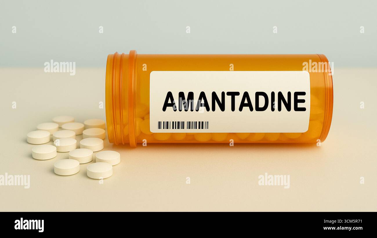 Box of AMANTADINE tablets on a hospital pharmacy table used to treat Parkinson disease and influenza an antiviral and antiparkinsonian. Stock Photo