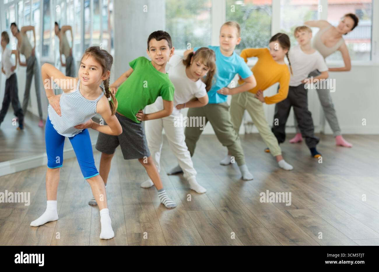Group of children warming up before dance class Stock Photo