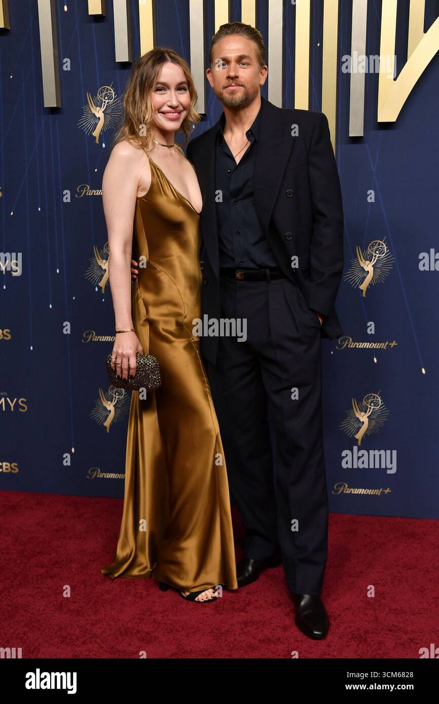 McNelis, left, and Charlie Hunnam arrive at the 77th Primetime