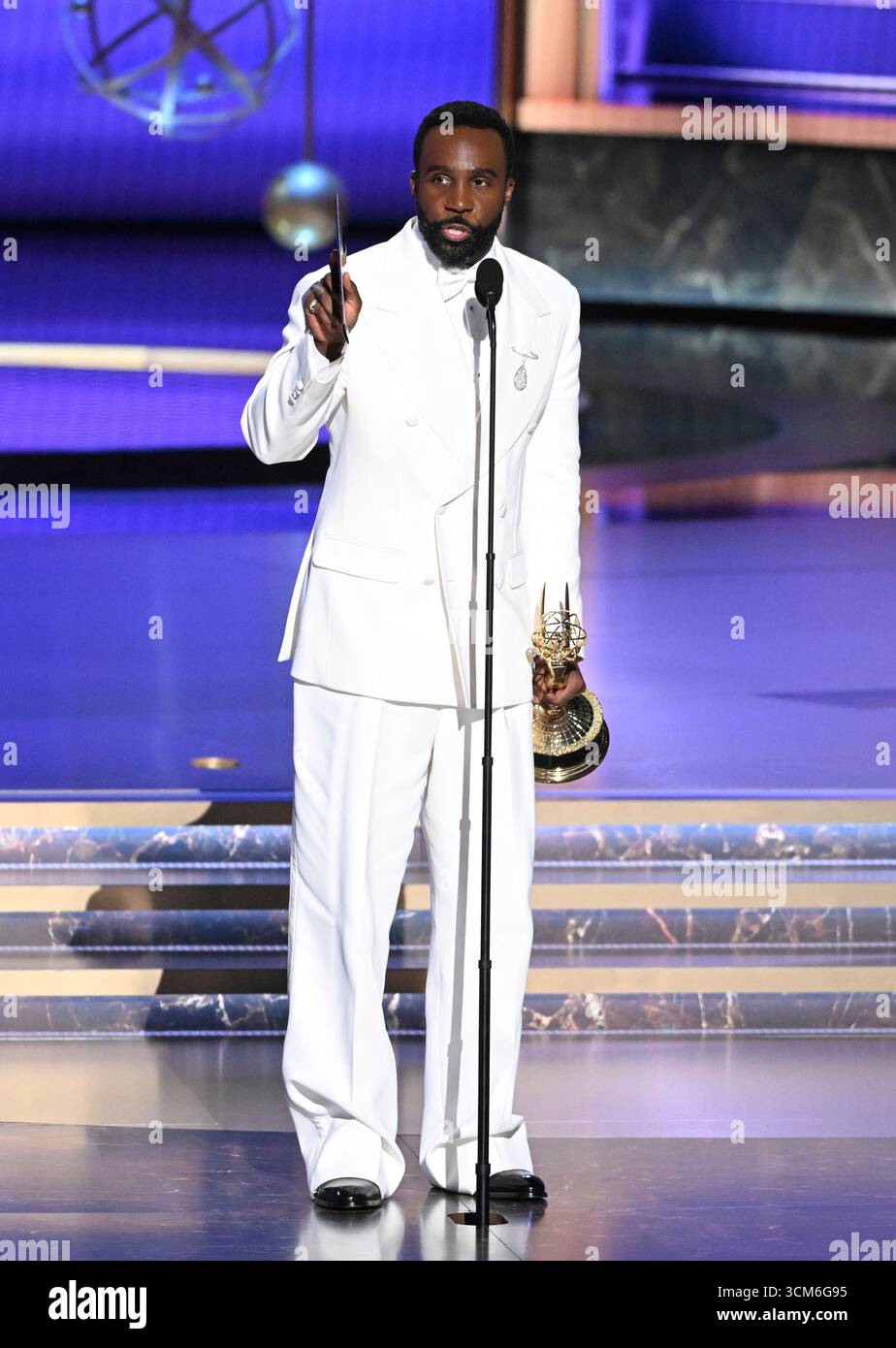 Tramell Tillman accepts the Outstanding Supporting Actor in a Drama