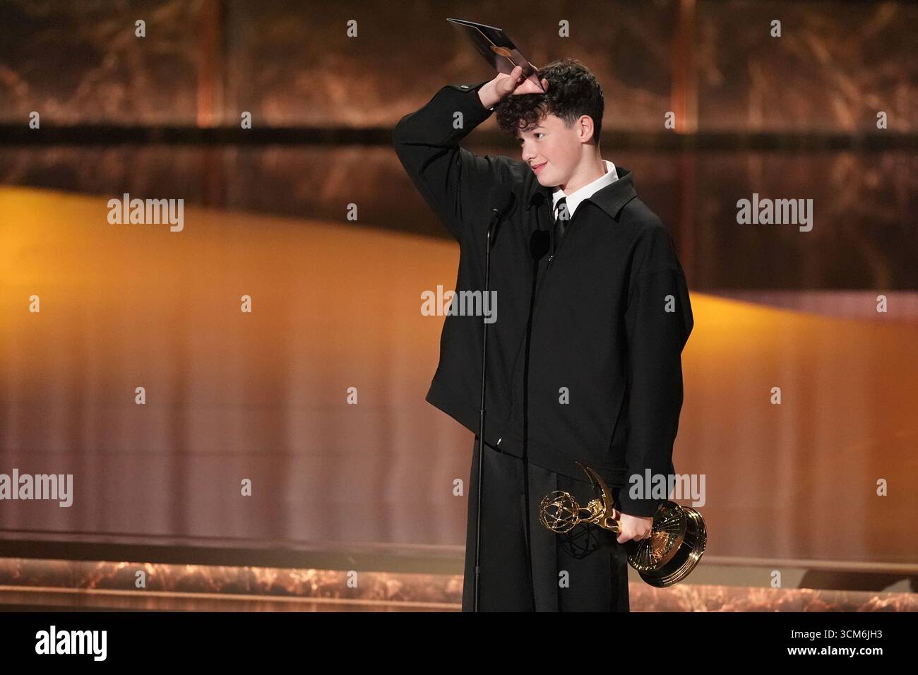 Owen Cooper accepts the award for outstanding supporting actor in