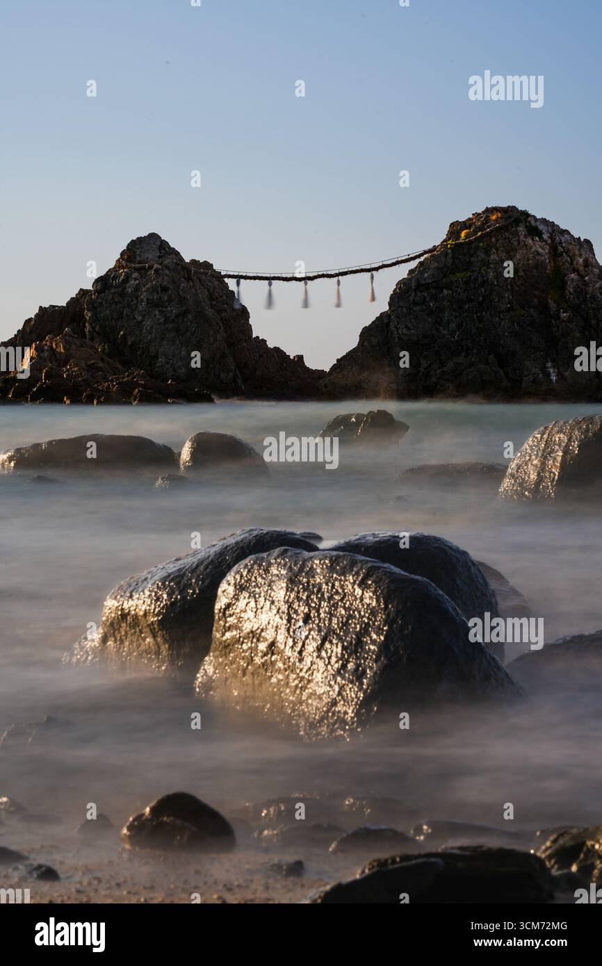 Red Rope Around Rocks Japan Meoto Iwa (Married Couple Rocks) connected by a sacred Shimenawa rope ...