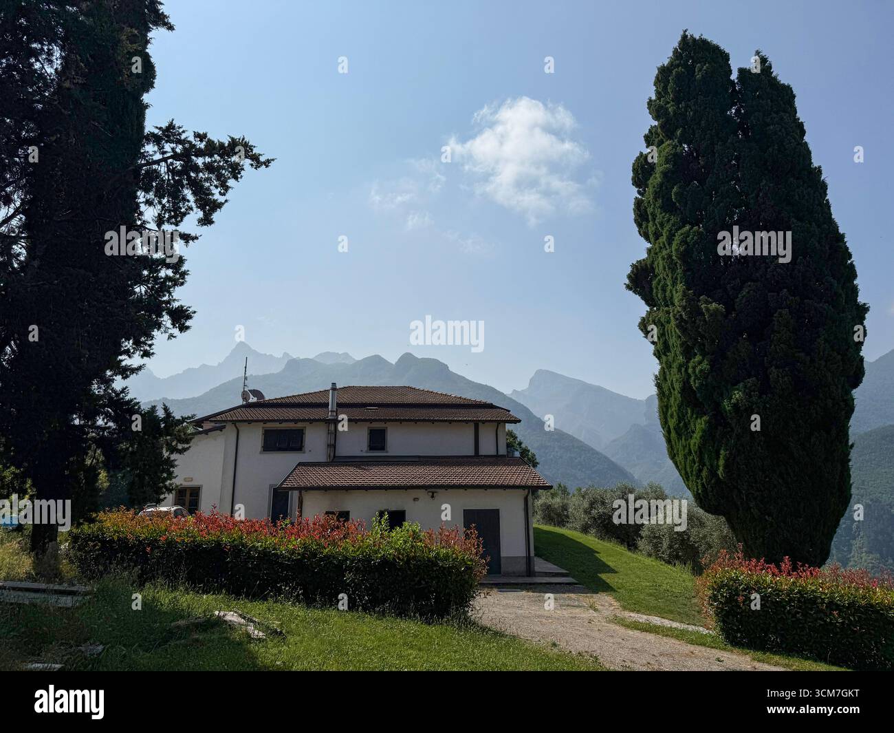 A restaurantl with sweeping views of the Monte dei Bianchi - Apuan Alps.  The limestone peaks including the dominant 1,781m high Pizzo d'Uccello in th - Smartphone Captured Stock Image