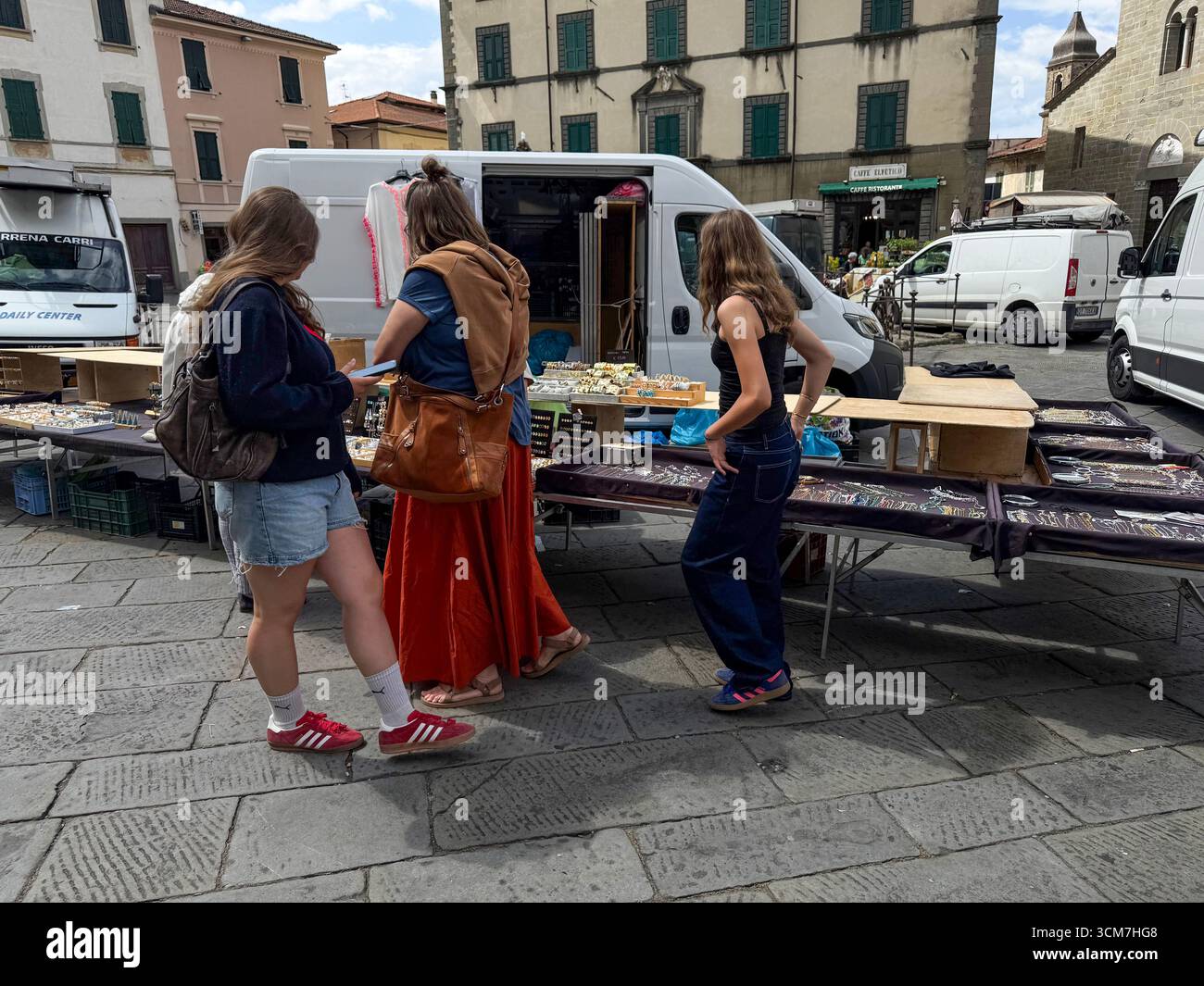 A jewellery stall at the weekly market held on the 16th century Piazza Medice) in the medieval town of Fivizzano, a commune in the province of Massa a - Smartphone Captured Stock Image