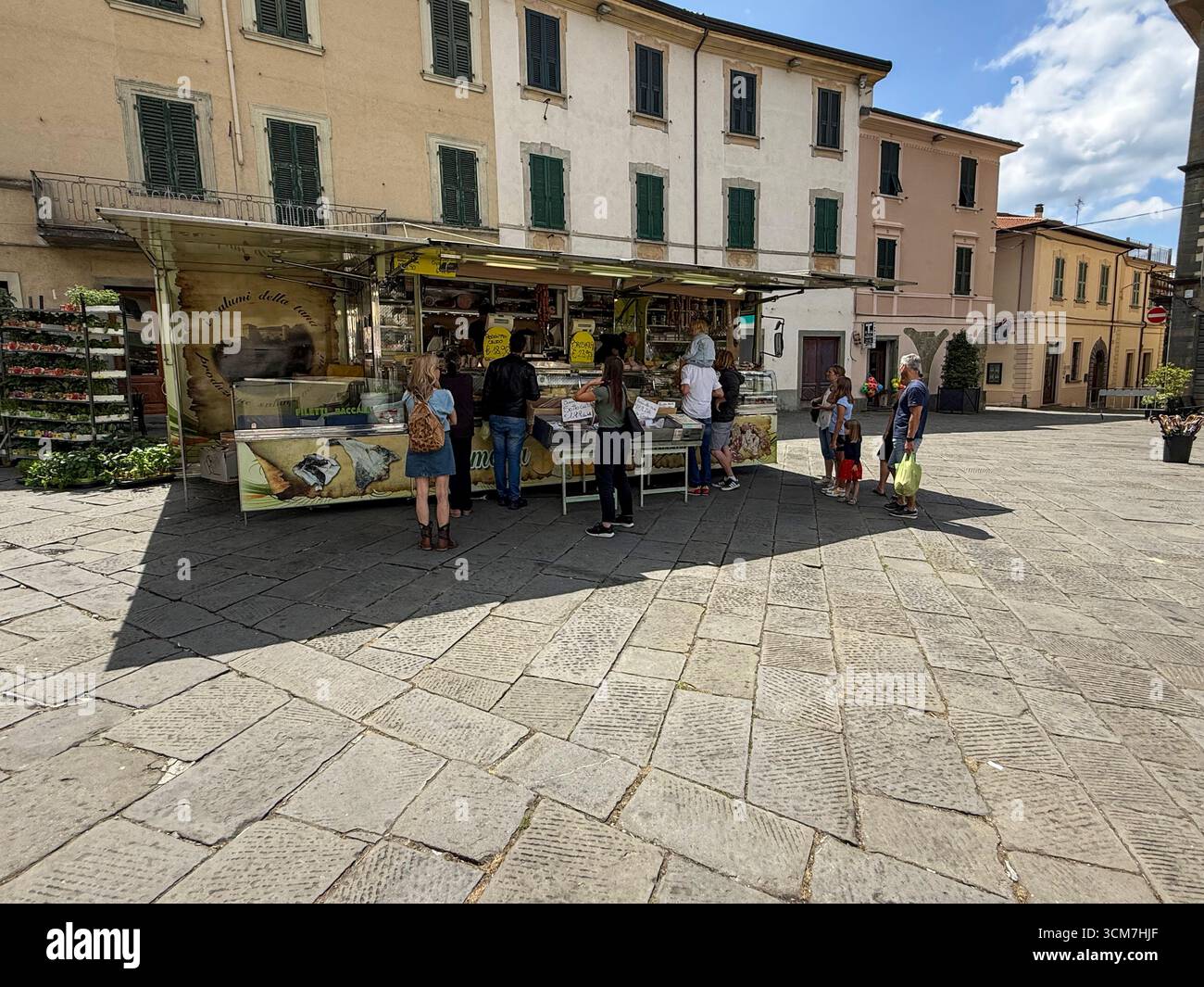 The weekly market day is held in front of the Chiesa del S. Jacopo e Antonio (Church of S. and Antonio on the 16th century Piazza Medice)  in the medi - Smartphone Captured Stock Image