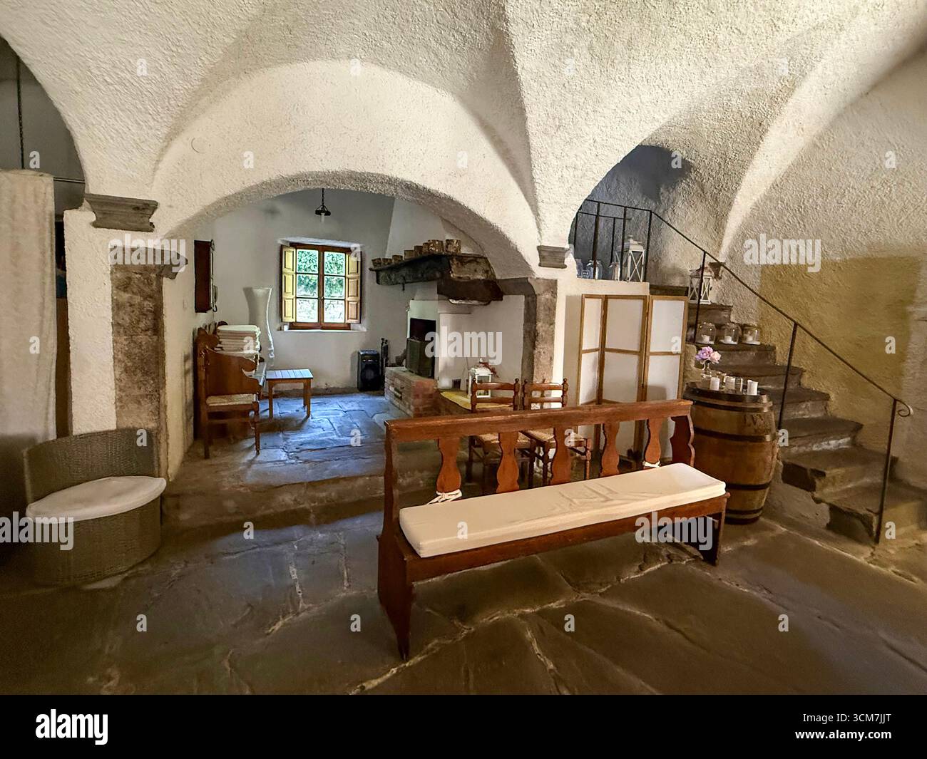 The dining room at the !6th century monastery called 11 convento del Carmine is near the small medieval town of Fivizzano in the commune province of M - Smartphone Captured Stock Image