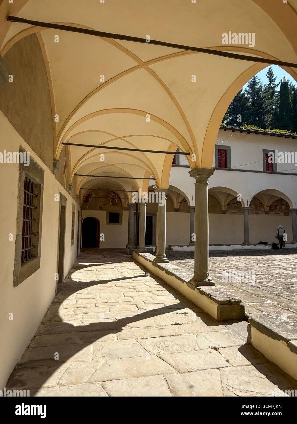 Main courtyard with surrounding cloisters and a well in the centre at the !6th century monastery called 11 convento del Carmine is near the small medi - Smartphone Captured Stock Image