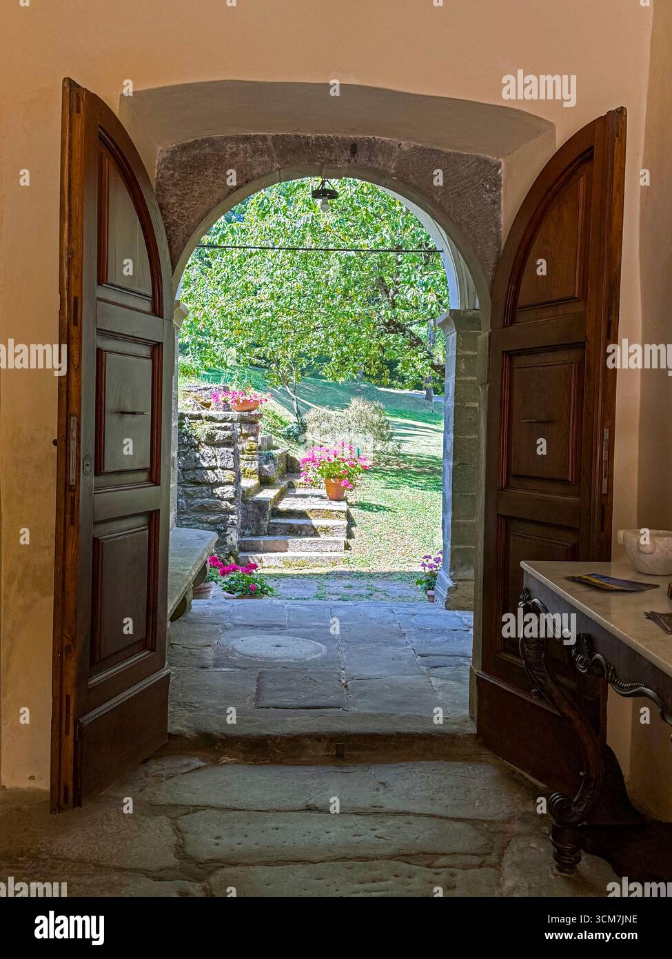 Through the main entrance leading into the central courtyard at the !6th century monastery called 11 convento del Carmine is near the small medieval t - Smartphone Captured Stock Image