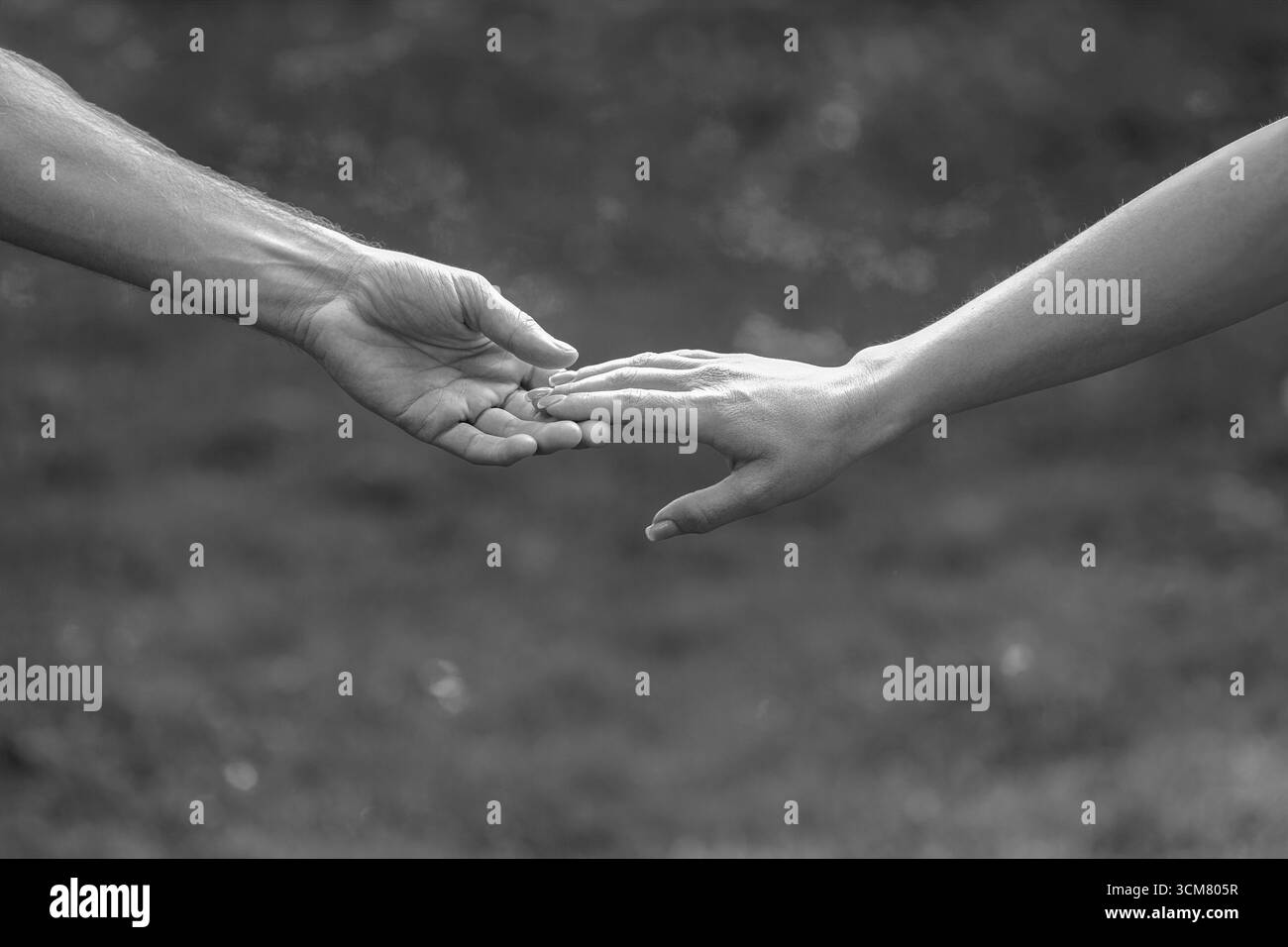 Hold hands male female Black and White Stock Photos & Images - Alamy