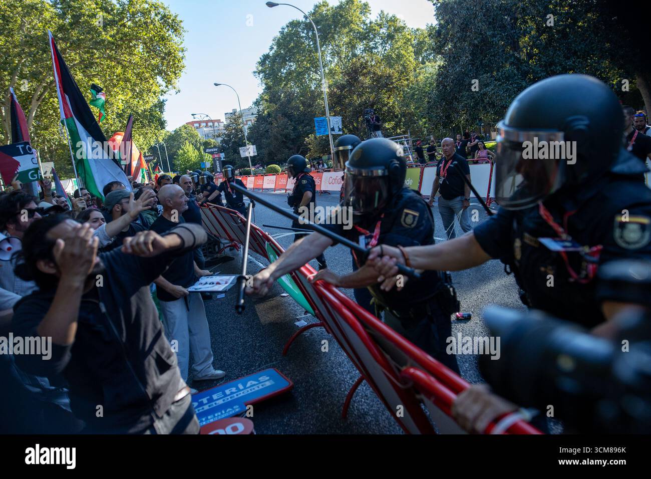 A group of riot police clash with protesters during the demonstrations ...
