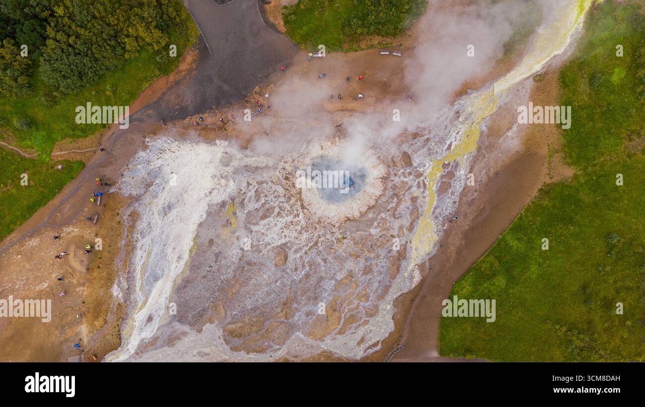 Hot Spring Stream With Rocks Geothermal hot spring with rising steam, surrounded by green vegetation ...