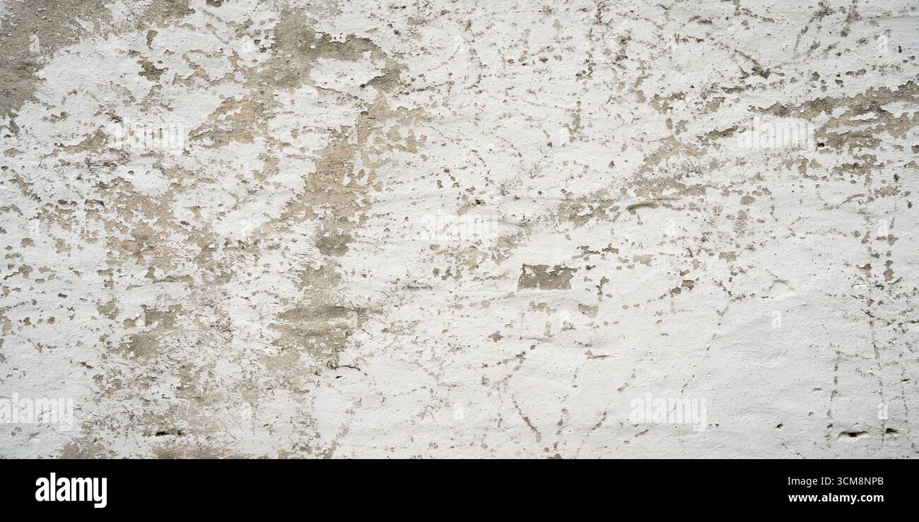 Gray concrete wall with peeling white color Stock Photo