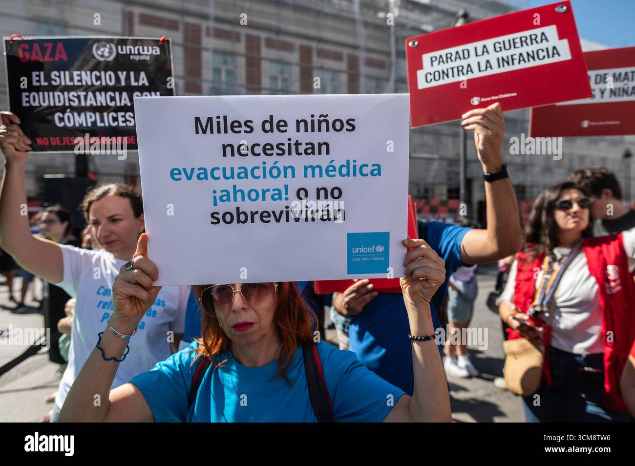 Madrid, Spain. 15th Sep, 2025. A group of activists carrying placards are seen during a protest that the “Artists with Palestine” platform has organized, a 10-hour event at Puerta del Sol in which the names of the Palestine children killed in Gaza during the Israeli attacks are being read. Credit: Marcos del Mazo/Alamy Live News Stock Photo