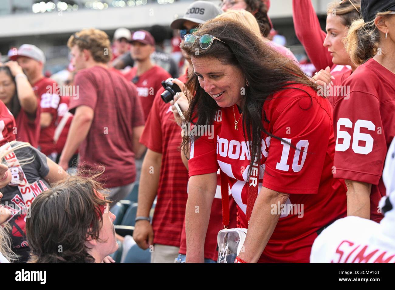 PHILADELPHIA, PA - SEPTEMBER 13: Quarterback John Mateer #10 of the  Oklahoma Sooners is shown with his mother, Judy Mateer, after the game  between the Temple University Owls and the University of