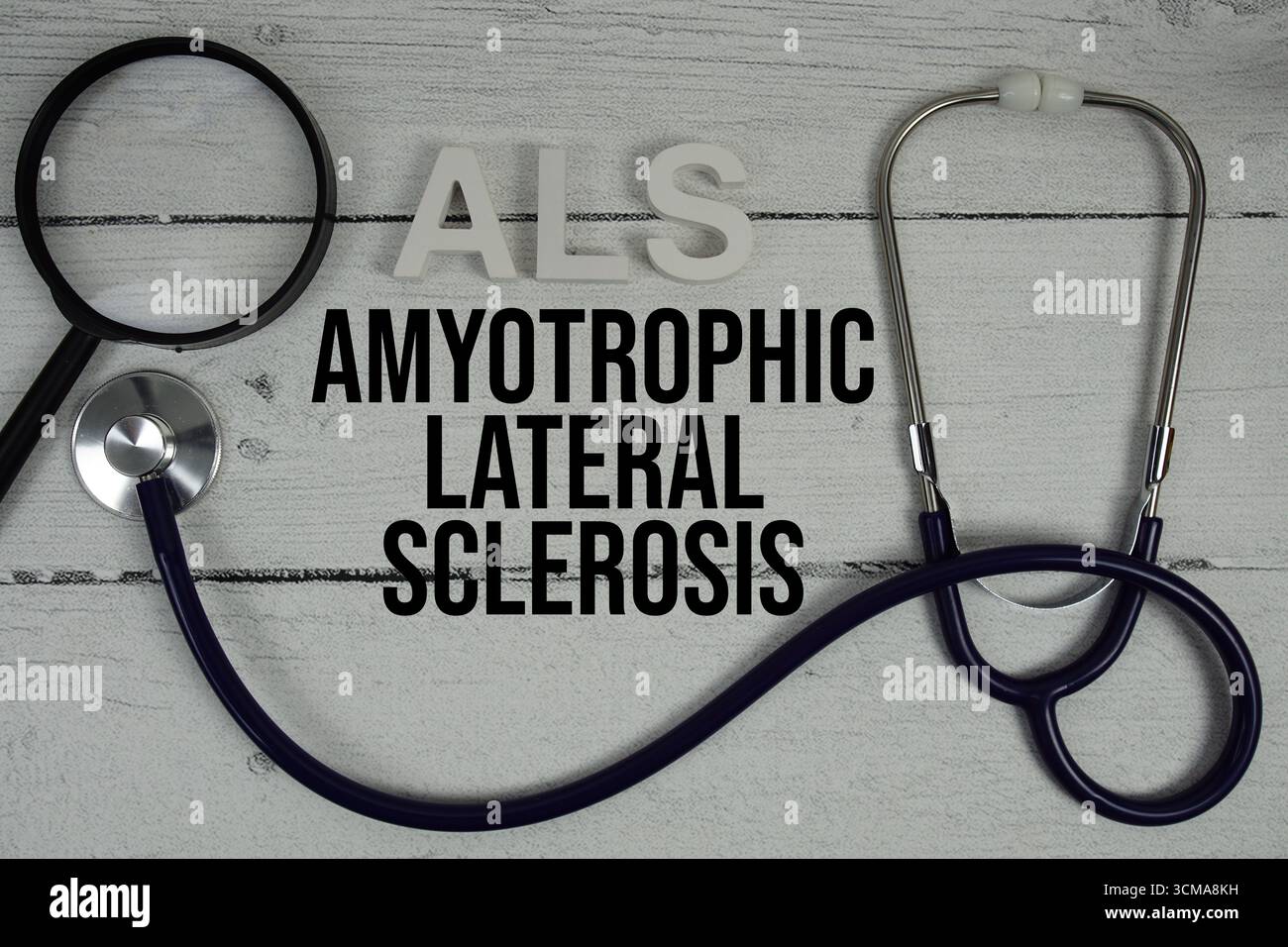 ALS Amyotrophic Lateral Sclerosis text with Stethoscope on wooden ...