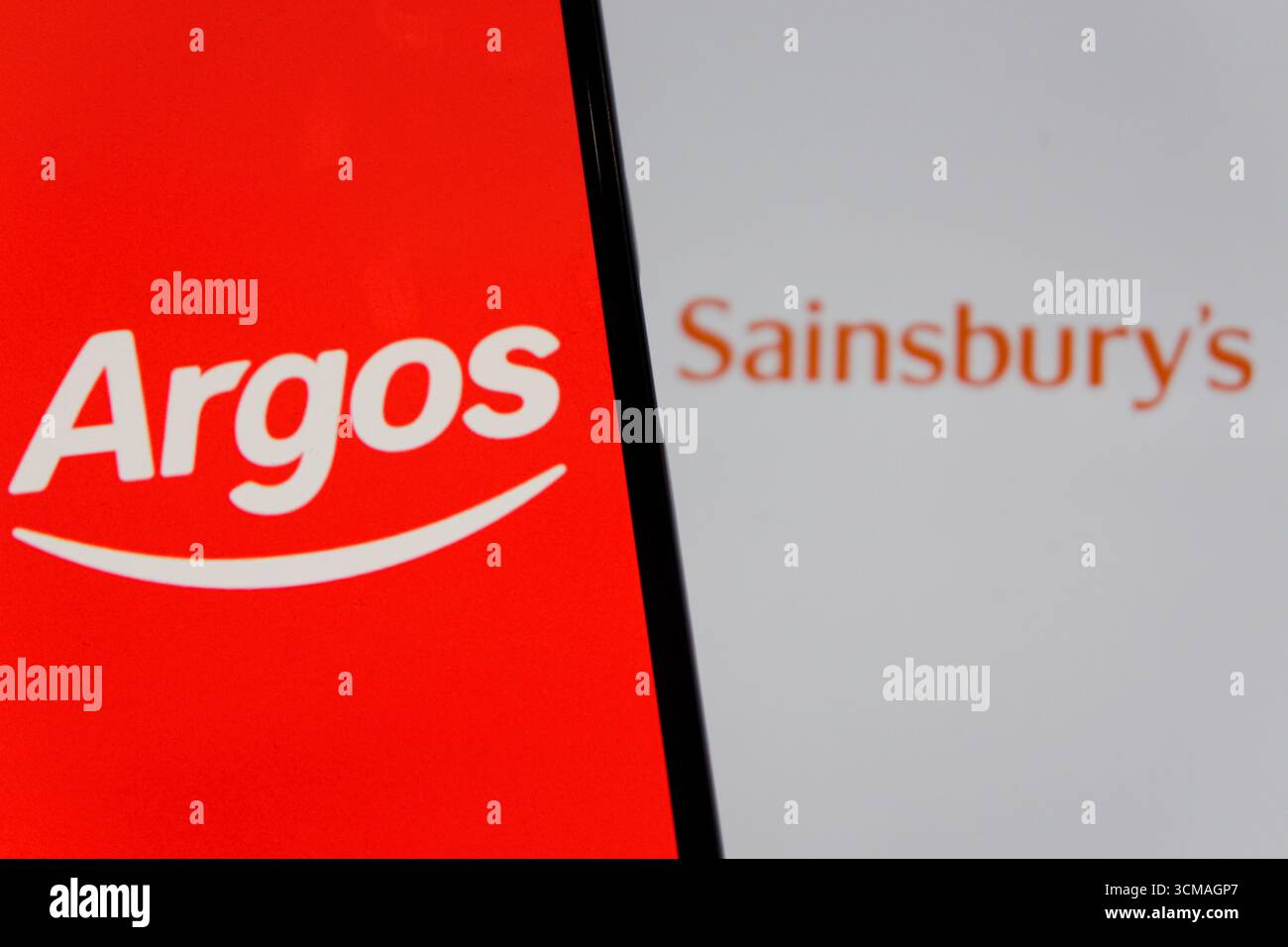 In this photo illustration, the Argos logo is displayed on a smartphone ...