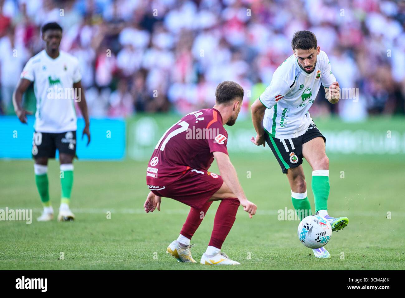 Andres Martin of Real Racing Club duels for the ball with Ivan Calero of Cultural y Deportiva Leonesa during the LaLiga Hypermotion match between Real Stock Photo