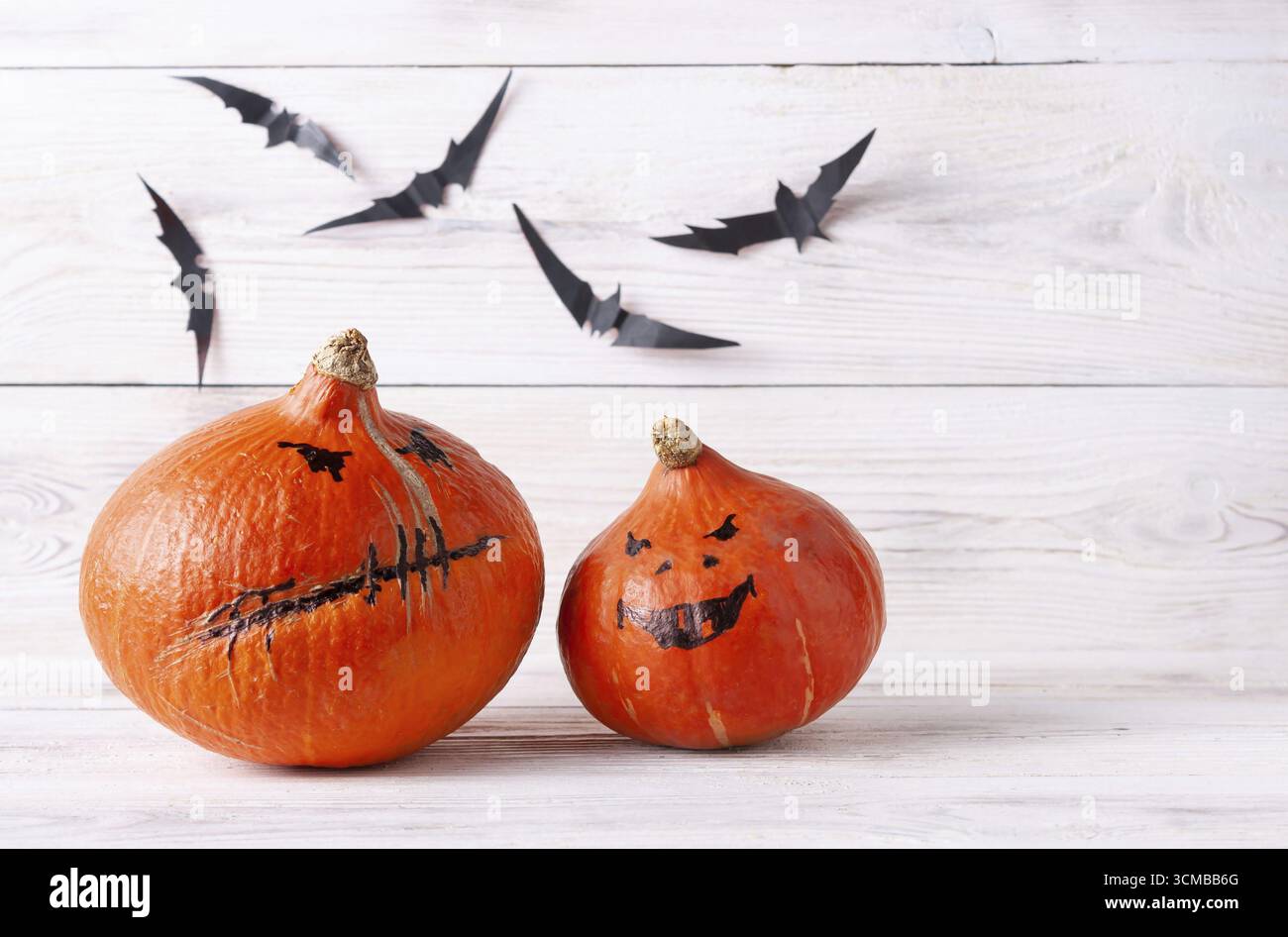 Pumpkins, black paper bats, Halloween decor Stock Photo Alamy