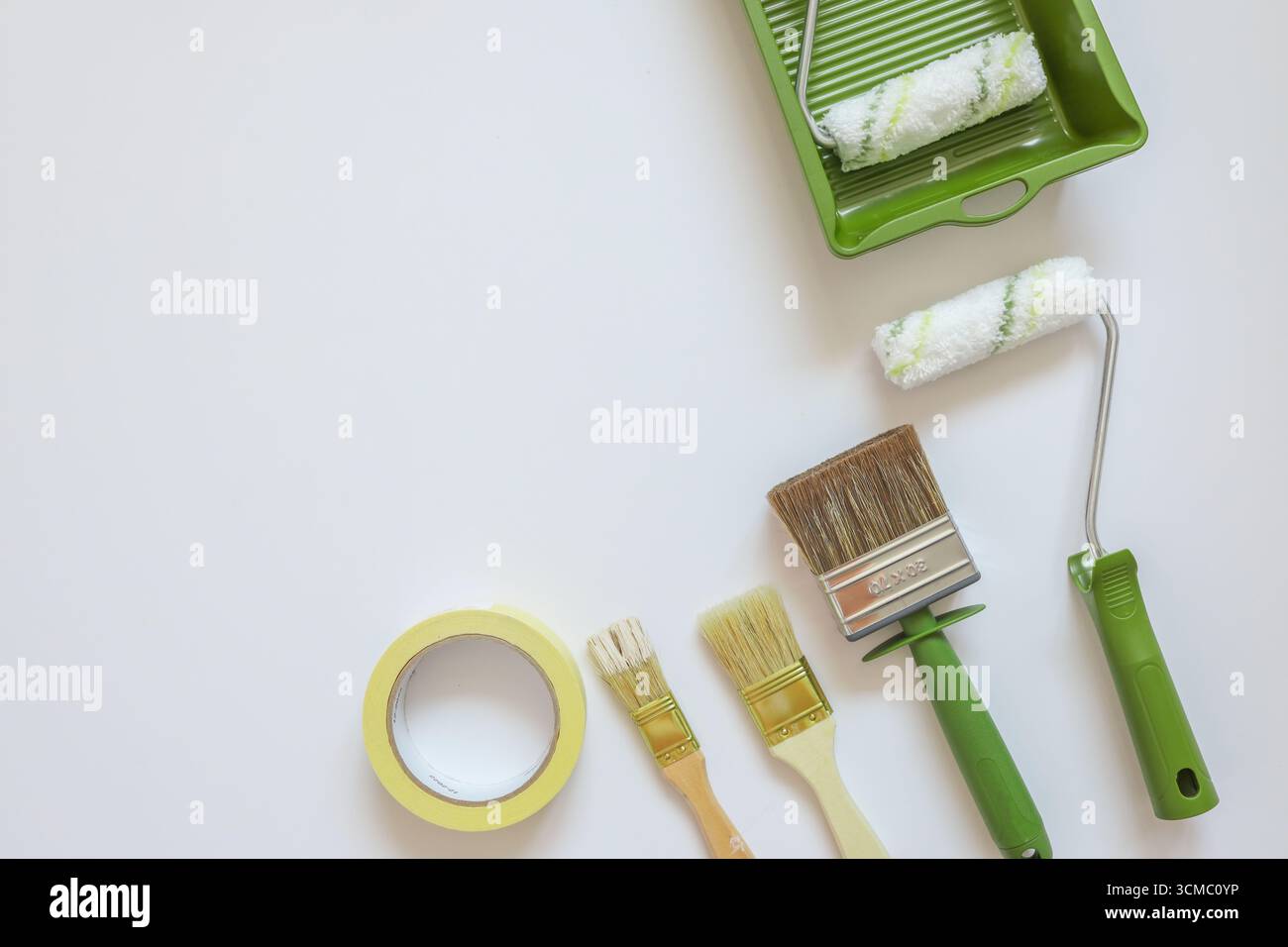 Top view wall painting tools on white background. Stock Photo