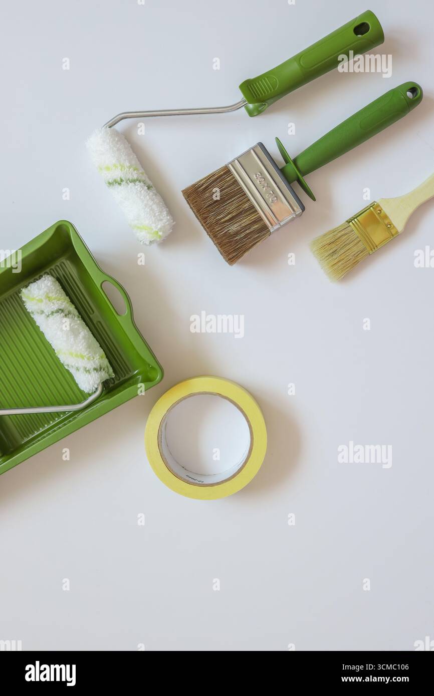 Top view wall painting tools on white background. Stock Photo