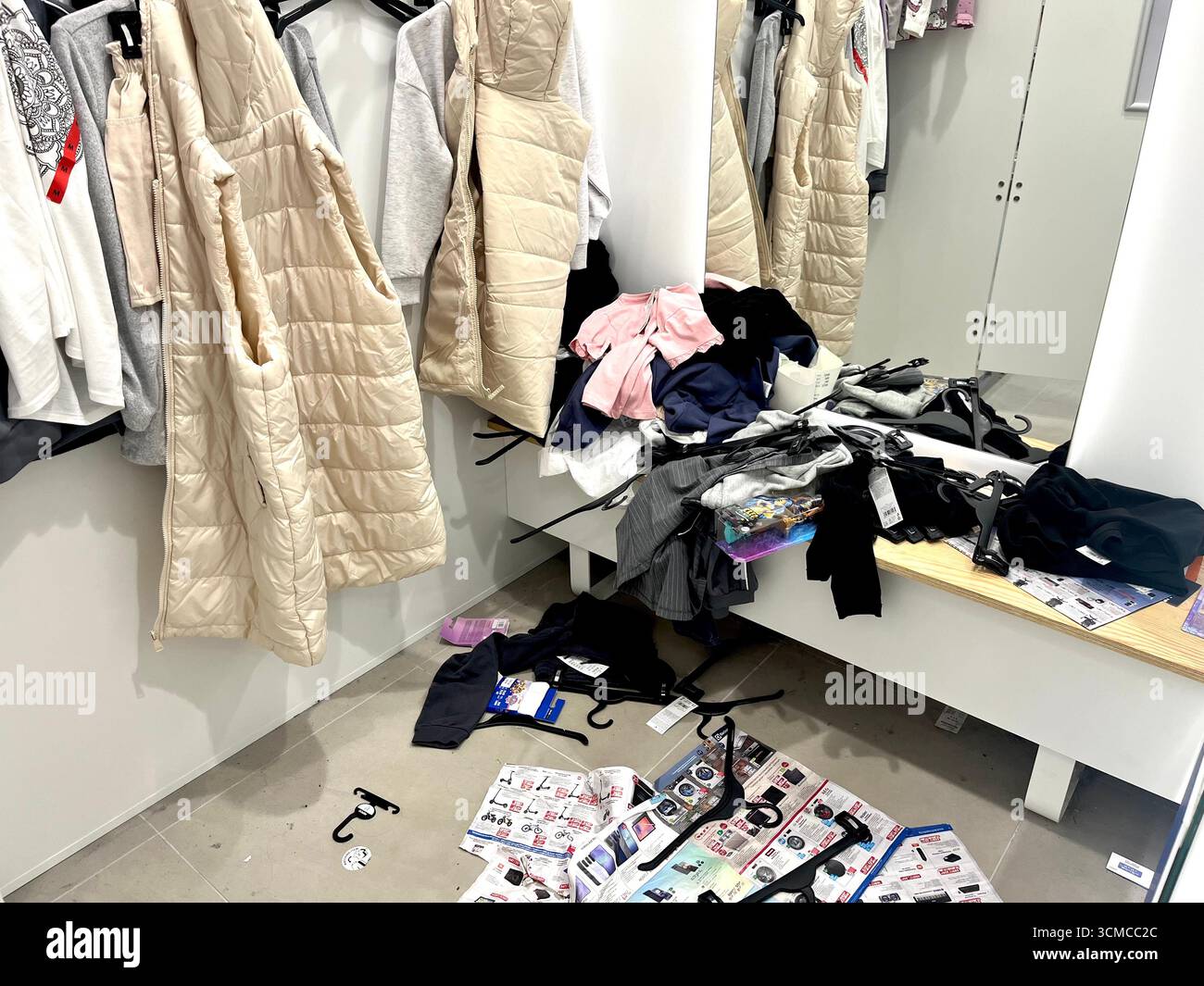 Private changing cubicle with clothes and items scattered inside a retail shopping centre in Sofia Bulgaria, Eastern Europe, Balkans, EU - Smartphone Captured Stock Image Private changing cubicle with clothes and items scattered inside a retail shopping centre in Sofia Bulgaria, Eastern Europe, Balkans, EU - Smartphone Captured Stock Image